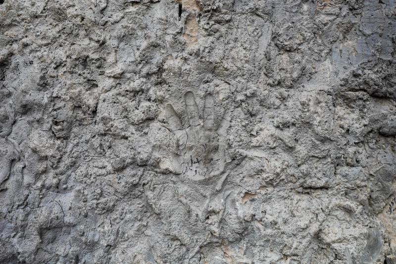 A hand imprint in the rock face of the cave of Uhud