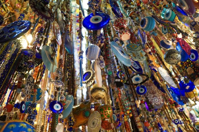 Evil eyes and other trinkets hanging from above