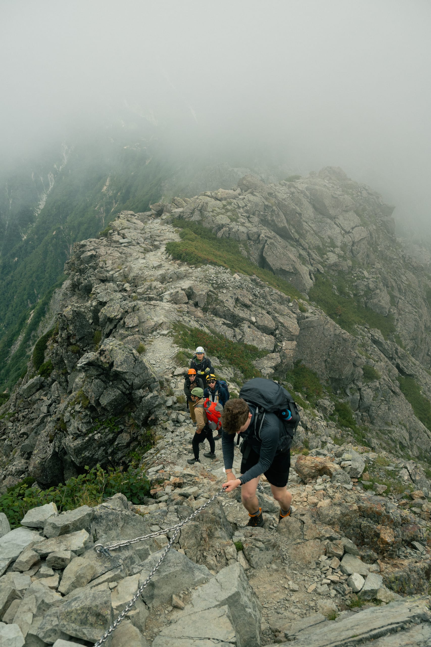 Climbers watch eachother begin the final push up Yarigatake