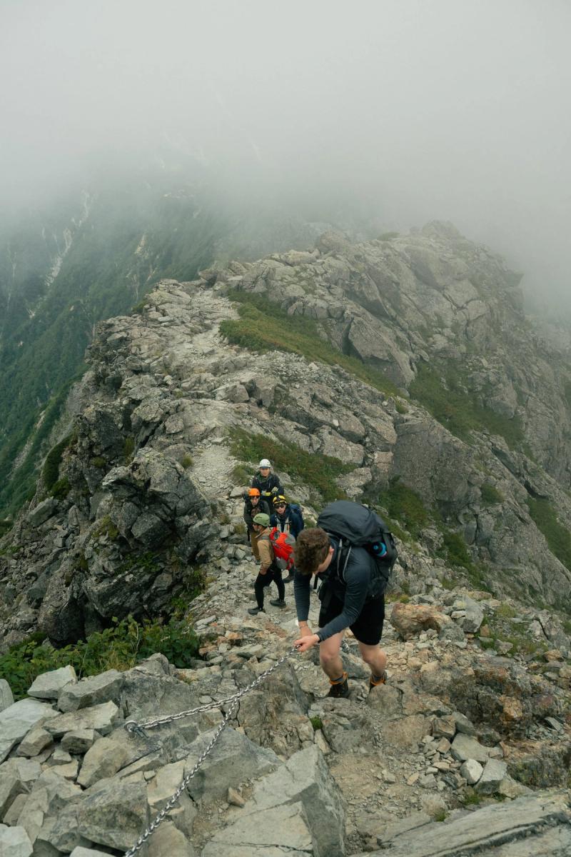 Climbers watch eachother begin the final push up Yarigatake