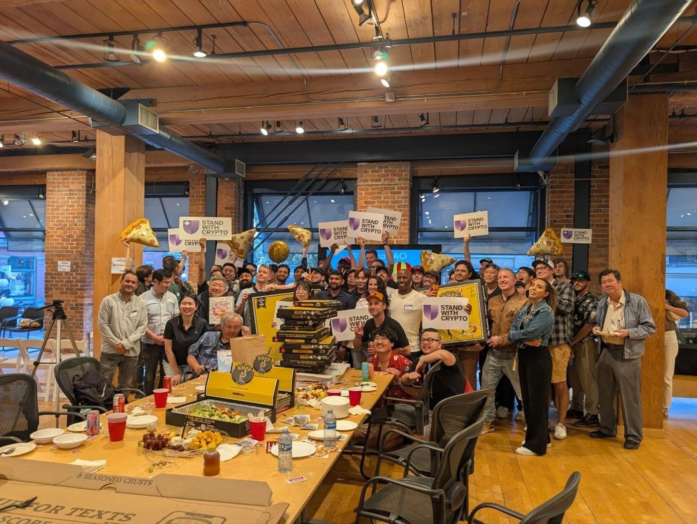 Happy community gathering at the Bitcoin Pizza Day 2026 Vancouver event, celebrating decentralized commerce and global crypto payment infrastructure with the CCPayment team.