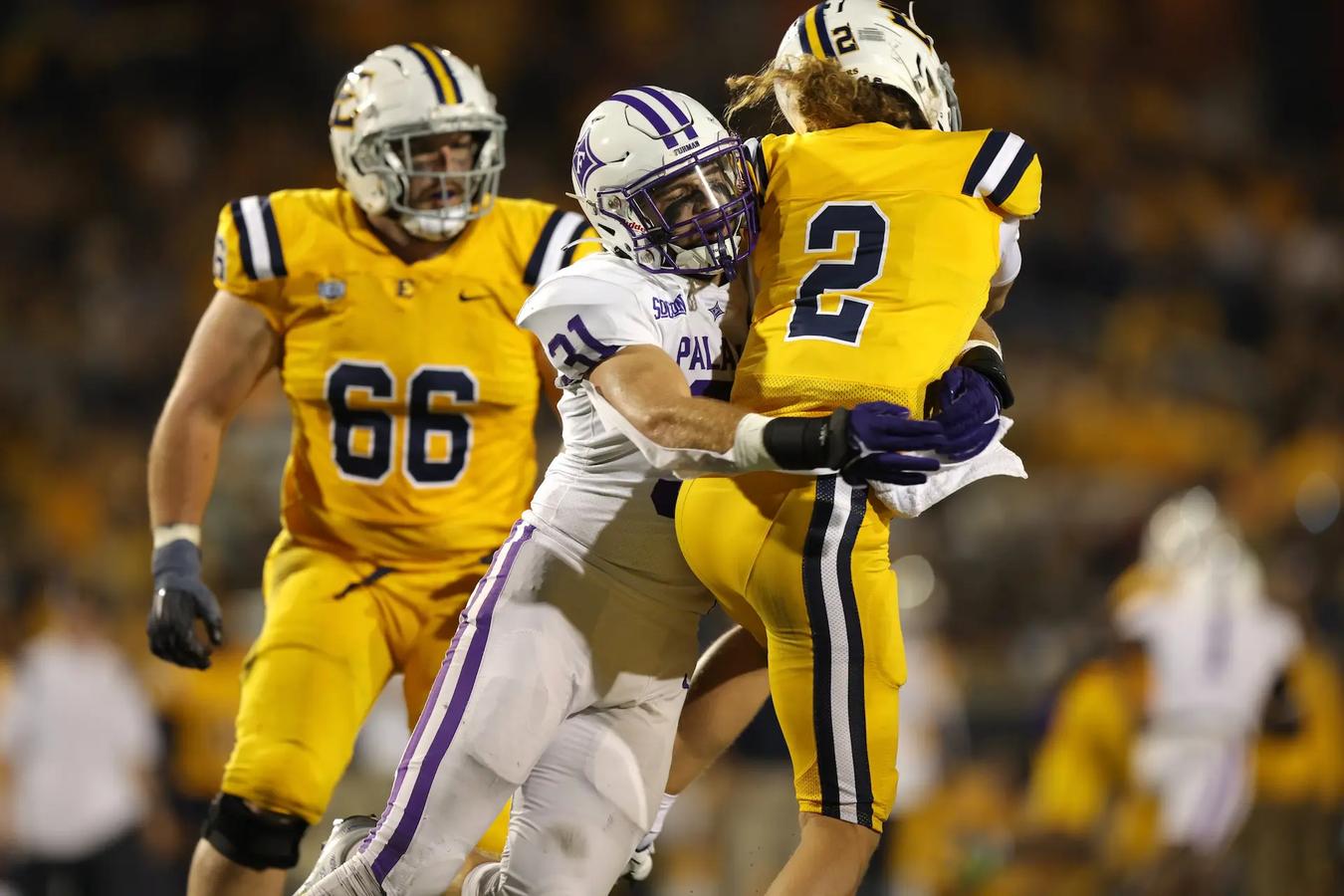 Furman's LB Bryce McCormick sacks ESTU's QB Tyler Riddell during their 27-14 upset over ETSU