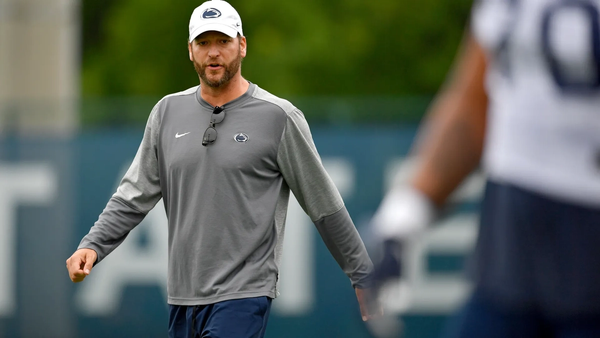 Penn State offensive coordinator Mike Yurcich yells to the offensive line as they prepare for a drill during an NCAA college football practice Saturday, Aug. 7, 2021, in State College, Pa.