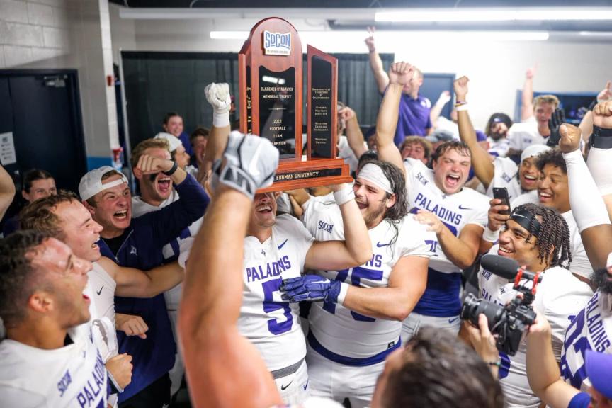 Furman football lifts SoCon Championship Trophy after beating Chattanooga
