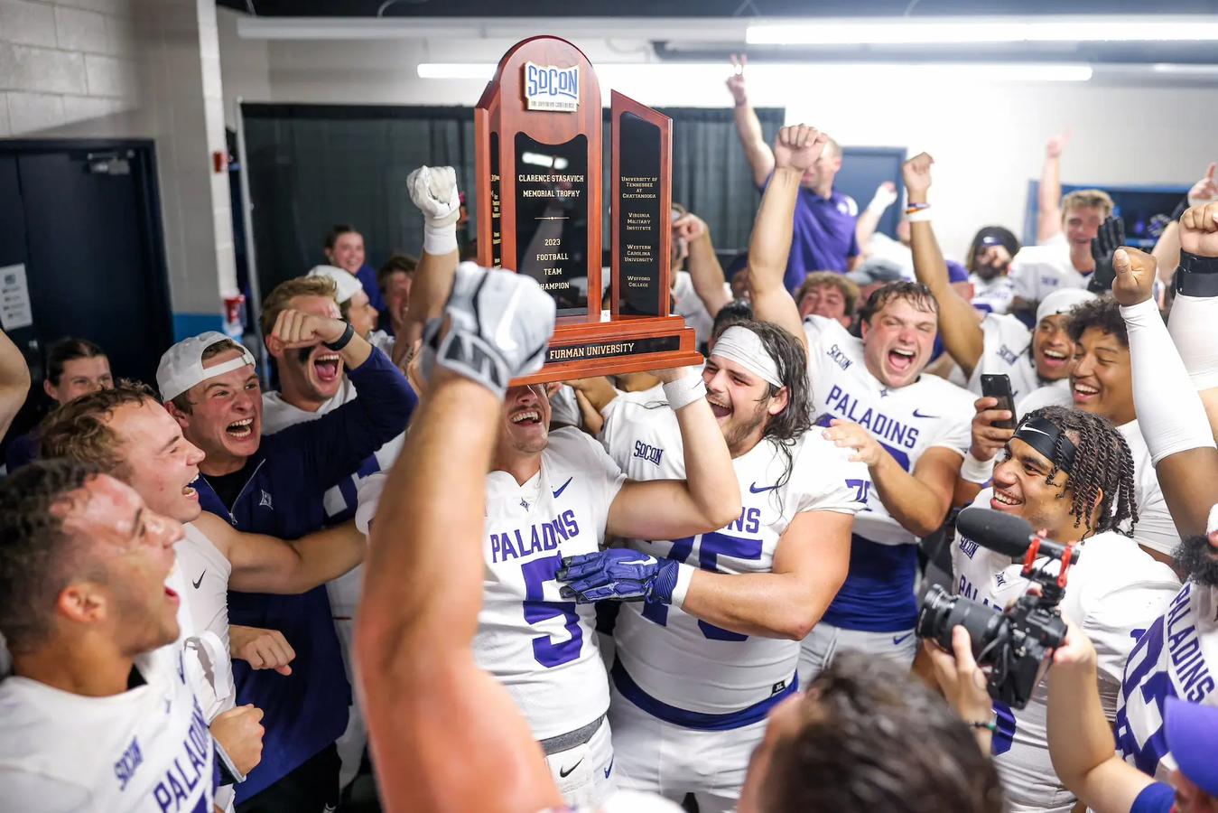 Furman football lifts SoCon Championship Trophy after beating Chattanooga