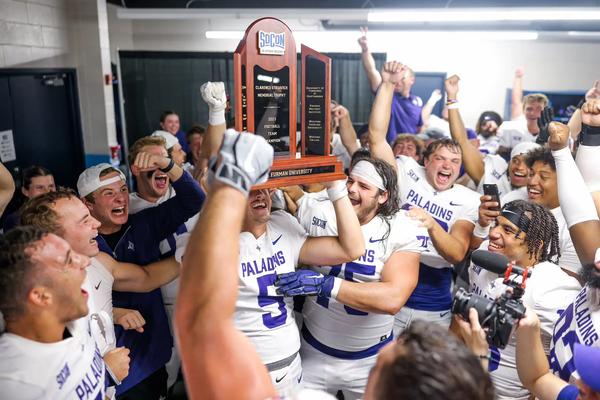 Furman football lifts SoCon Championship Trophy after beating Chattanooga