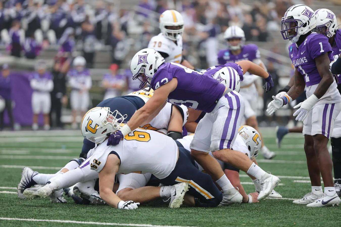 Furman inside linebacker Braden Gilby pancakes Chattanooga OL Malone VanGorder