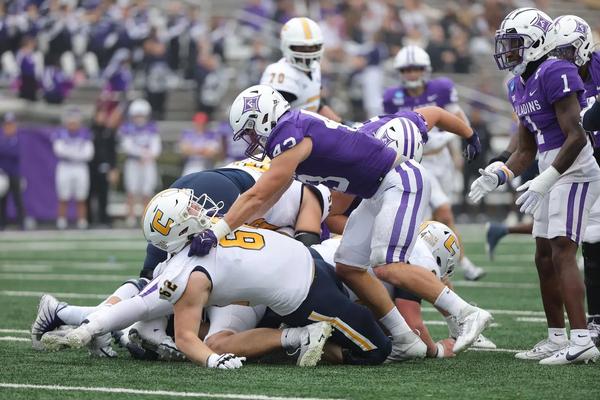 Furman inside linebacker Braden Gilby pancakes Chattanooga OL Malone VanGorder