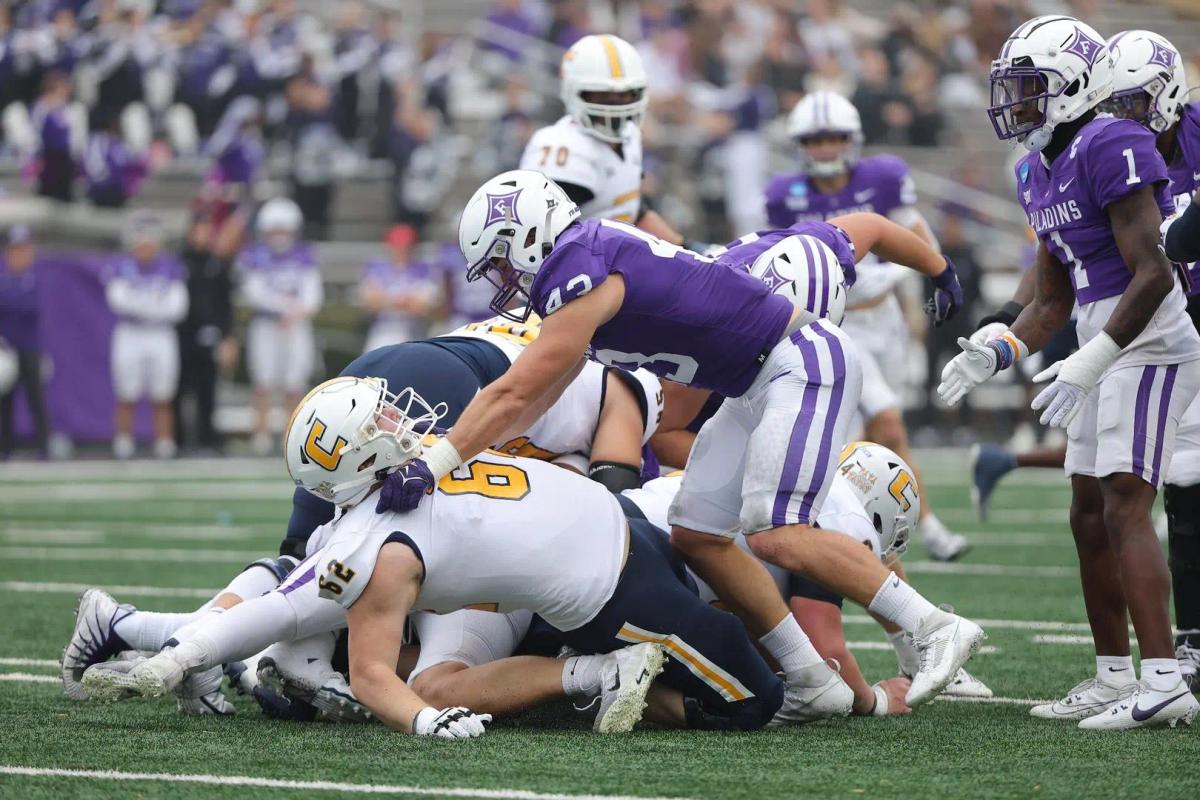 Furman inside linebacker Braden Gilby pancakes Chattanooga OL Malone VanGorder
