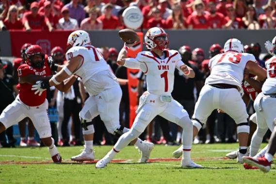 VMI QB Collin Shannon attempts a pass against NC State, Sept. 16, 2023