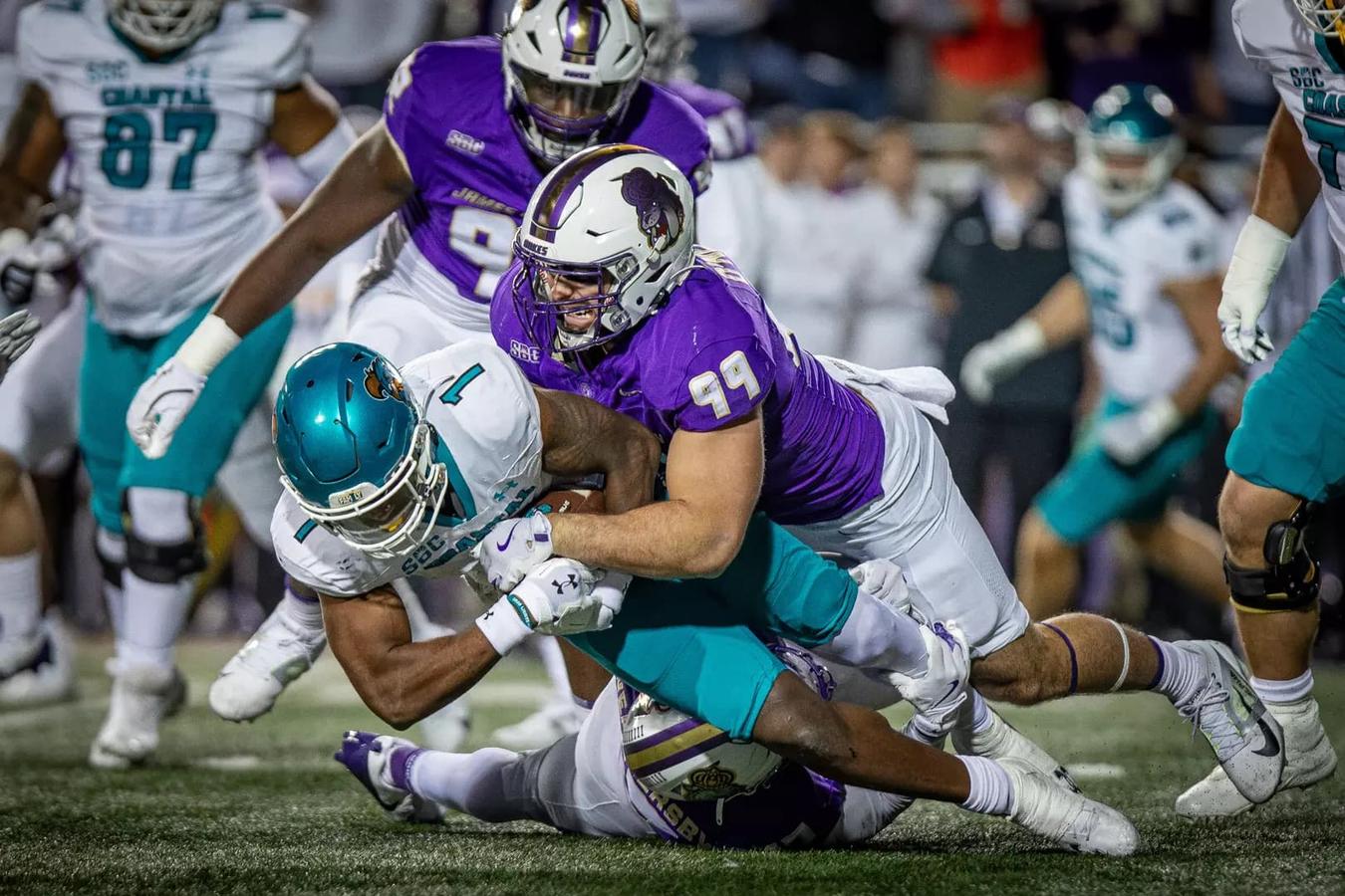 JMU DL Eric O'Neill makes a tackle during their 39-7 victory over Coastal Carolina