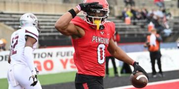 Youngstown State's Bryce Oliver saluting the camera after a touchdown.