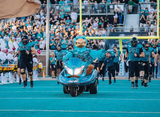 Chauncey the Chanticleer Leads the Chants Onto the Field