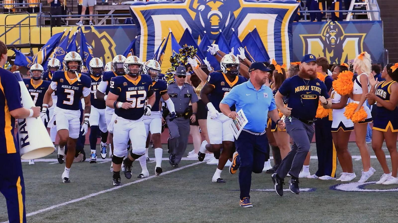 Murray State Football team running onto the field