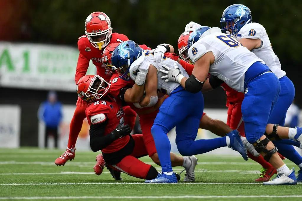 Youngstown State defender attempts to tackle a South Dakota State offensive player