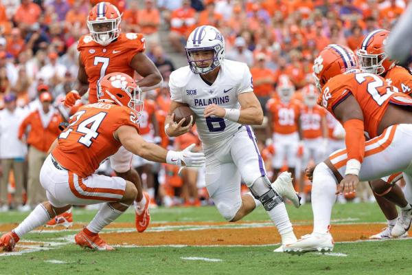 Furman QB Tyler Huff rushing against Clemson during their 35-12 loss
