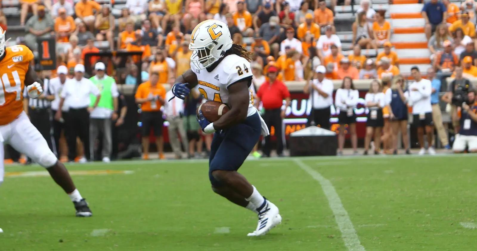 UTC RB Elijah Ibitokun-Hanks rushing against the University Tennessee
