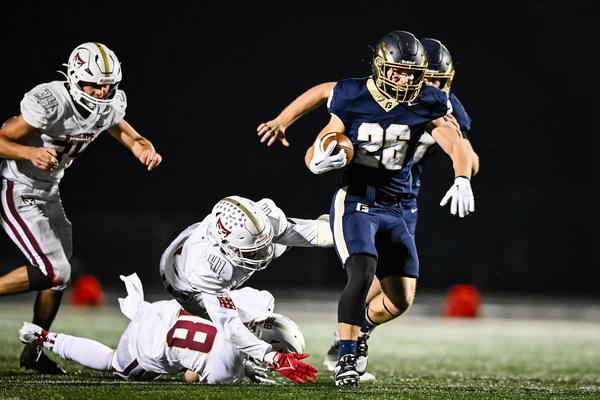 George Fox's RB Mason McBride breaking tackles against Willamette