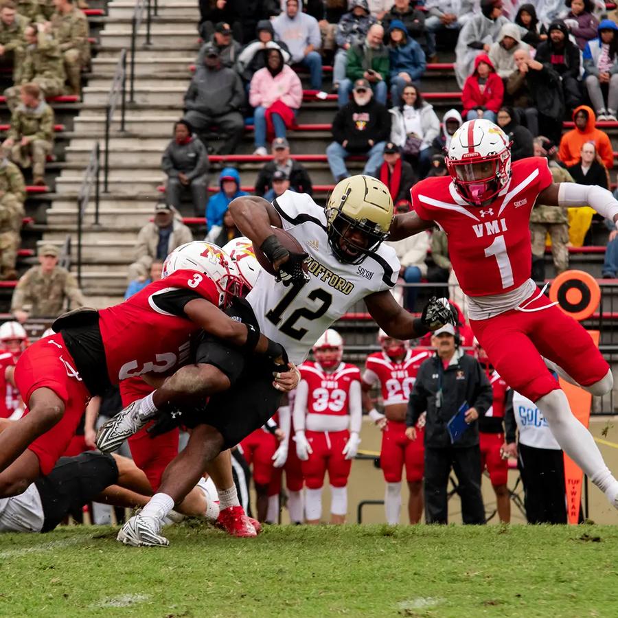 VMI defenders tackling Wofford's #12