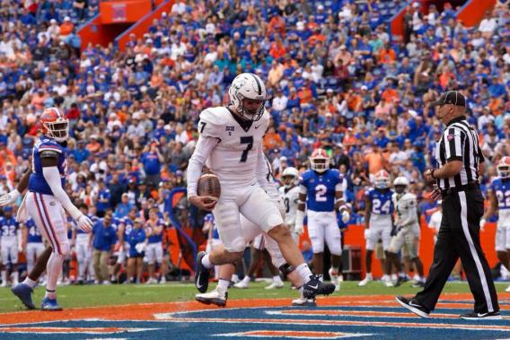Samford QB Welch scores a rushing touchdown at Florida. Nov. 13, 2021.