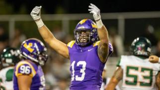 Cal Lutheran DL Jackson White celebrates after a play against La Verne