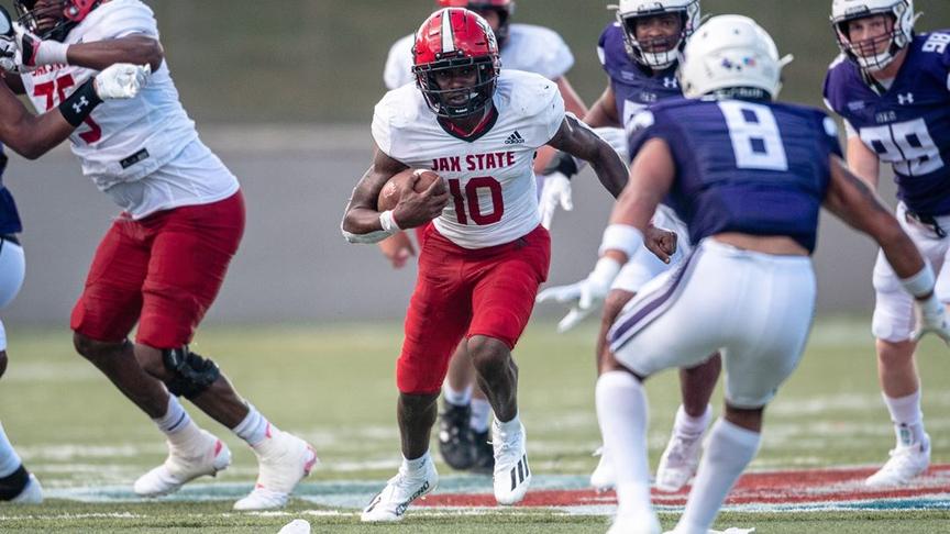 Jacksonville State's Zion Webb tucks the ball and runs against Stephen F. Austin during their August 27th, 2022 matchup.