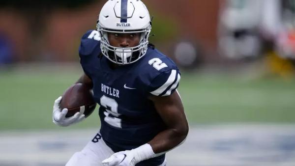 Butler football player running with the ball