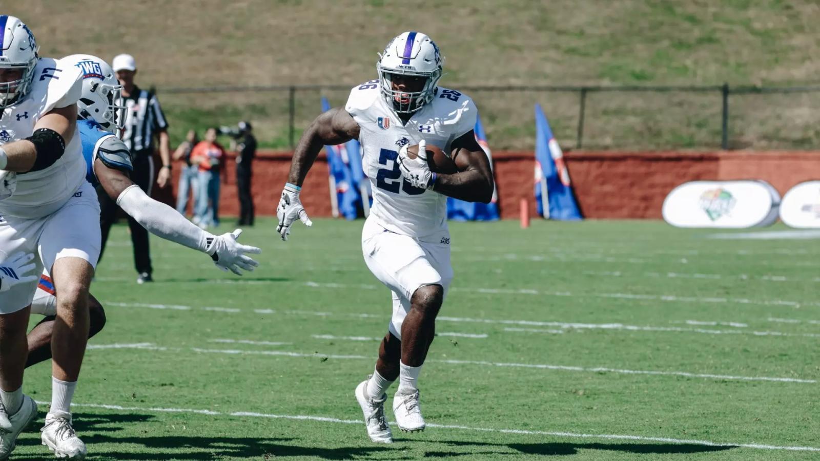 Abilene Christian running back rushing the ball
