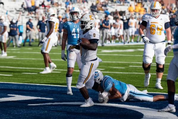 UTC's Ailym Ford drags a Citadel defender into the end zone