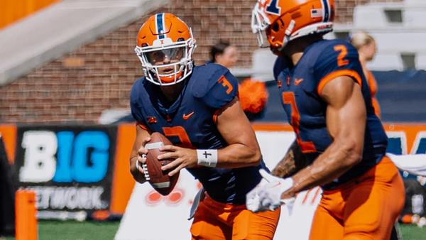2022 QB Tommy DeVito prepares to pass to team-mate Chase Brown. Devito was signed on Saturday to play for his home state’s New York Giants as an undraftrd free agent.