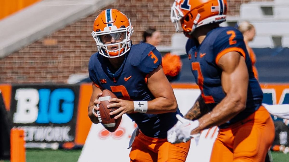 2022 QB Tommy DeVito prepares to pass to team-mate Chase Brown. Devito was signed on Saturday to play for his home state’s New York Giants as an undraftrd free agent.