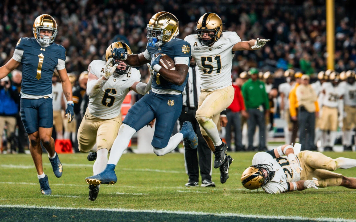 Notre Dame Football player rushes for a touchdown against Army during their 48-14 win.