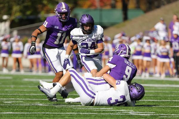 Furman's #39 and 24 converge to take down Western Carolina's QB.