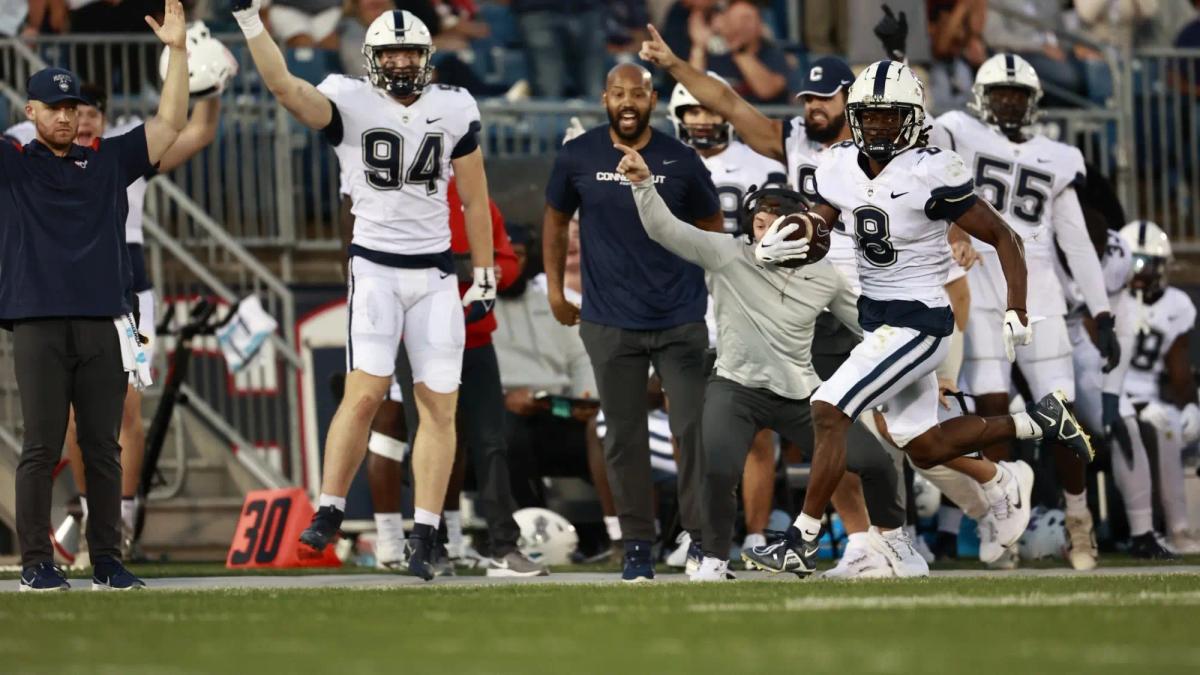 UConn WR TJ Sheffield running down the sideline after catching a pass during their win over Temple
