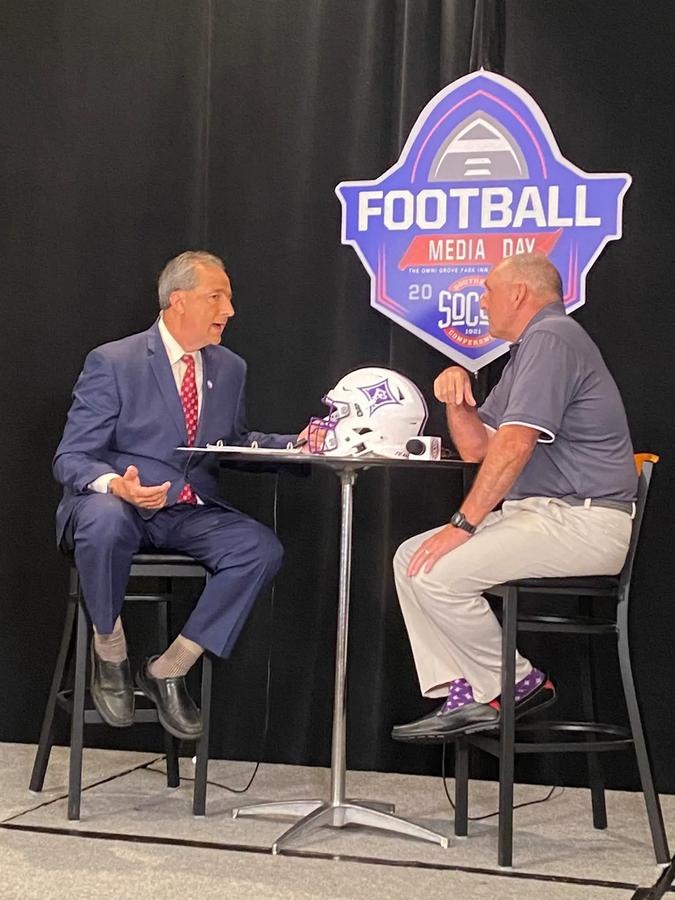 Furman Head Coach Clay Hendrix being interviewed during the 2022 SoCon Media Day
