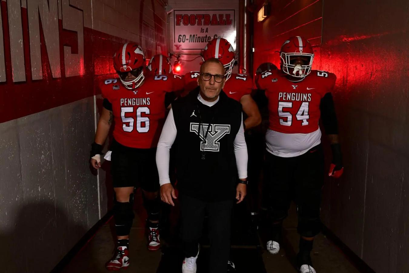 Youngstown State's Head Coach Doug Phillips leading the team from the locker rooms onto the field