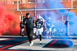Samford football running out of the tunnel