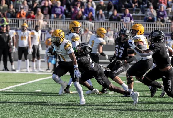Weber State defender tackles a member of Idaho's offense