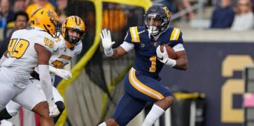 East Tennessee State running back Quay Holmes scores a touchdown against Kennesaw State