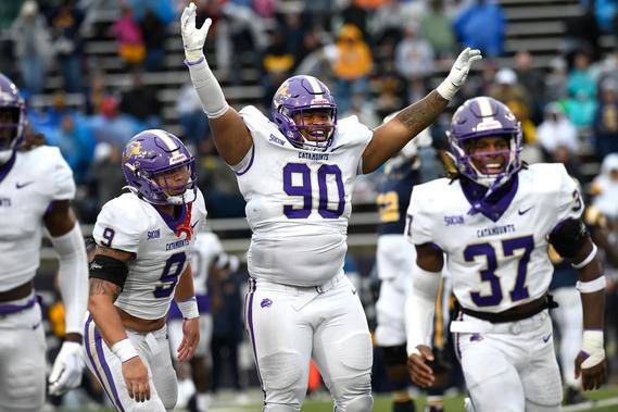 No. 90 of Western Carolina celebrates against ETSU