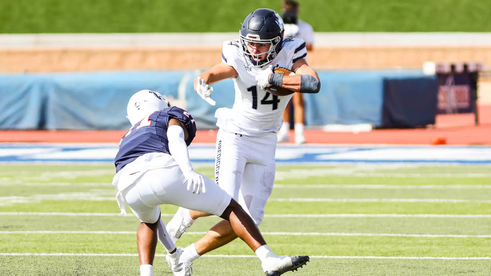 Colorado School of Mines WR Flynn Schiele stiff arms a defender