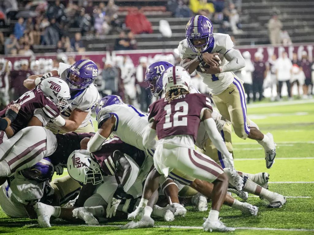 Desmond Reid (1) leapt over the line into the end zone for a one-yard touchdown run in WCU's road win at EKU.