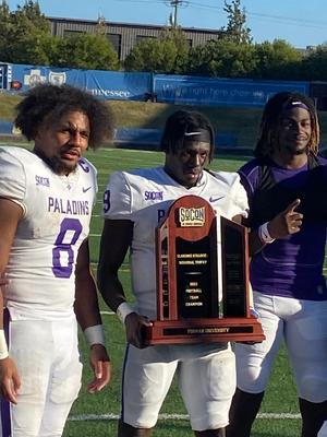 Dominic Roberto (left), Wayne Anderson Jr. (middle) and Joshua Harris (right) celebrate Furman’s SoCon title-clinching win at Chattanooga last November