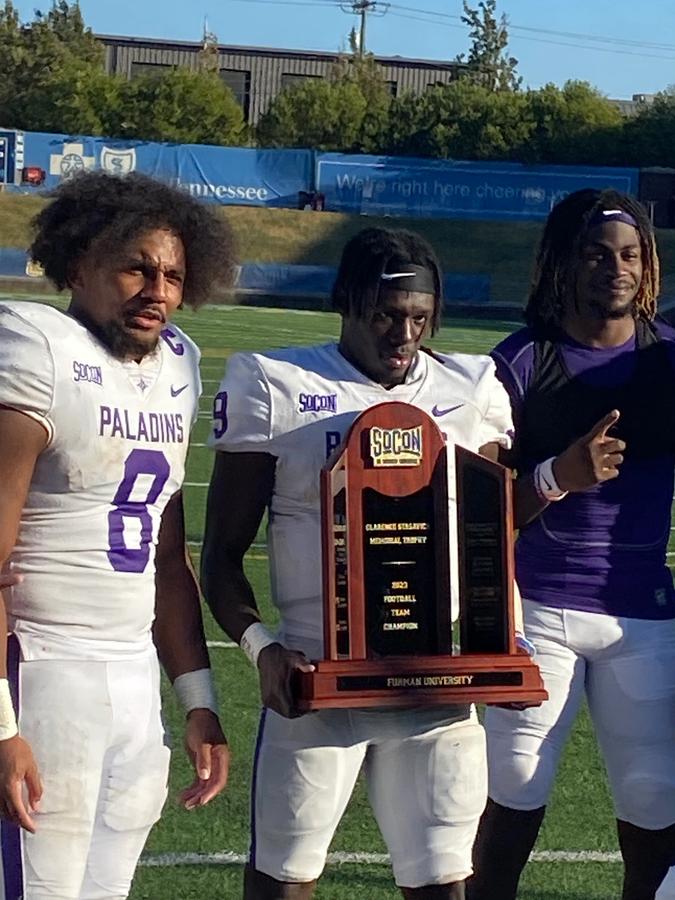Dominic Roberto (left), Wayne Anderson Jr. (middle) and Joshua Harris (right) celebrate Furman’s SoCon title-clinching win at Chattanooga last November