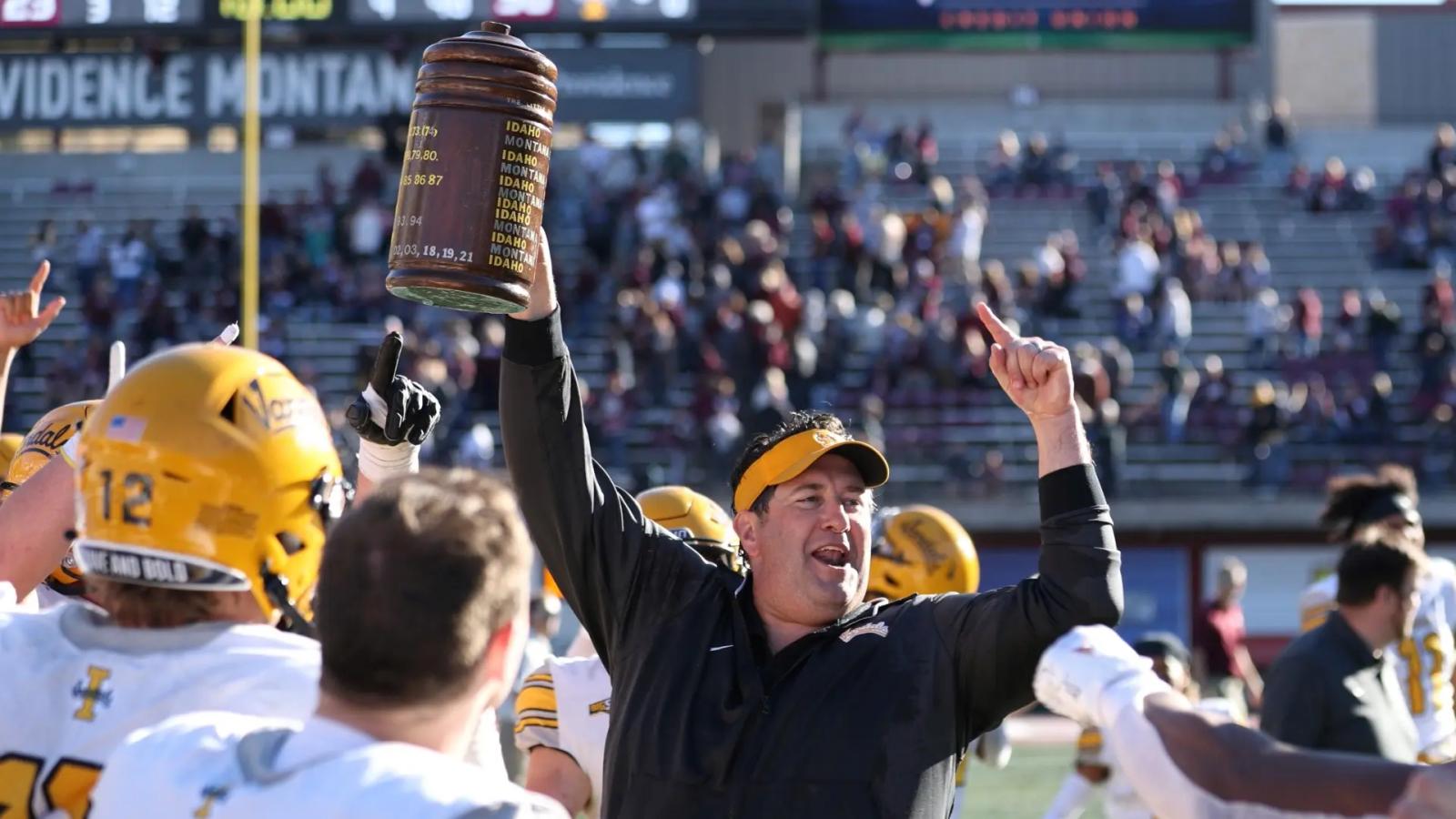 Idaho Vandals head coach Jason Eck holds up the Little Brown Stein after the Vandals defeat the Griz during the Big Sky Conference football game between the Griz and Idaho at Washington-Grizzly Stadium, Saturday, Oct. 15, 2022.