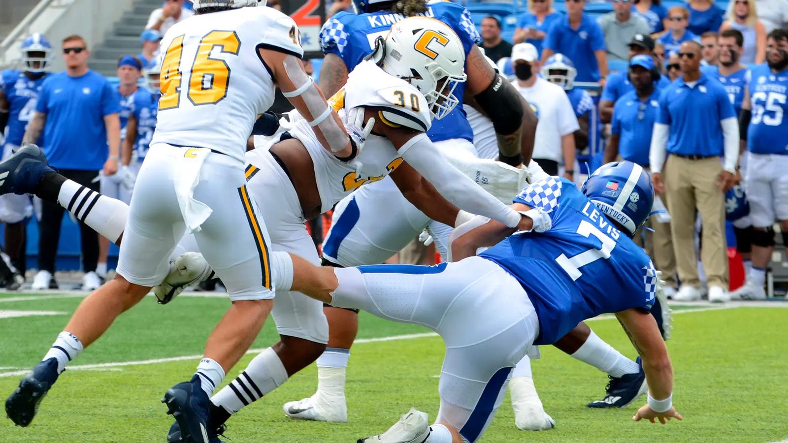 UTC's linebacker Jay Person lays a hit on Kentucky's QB Will Levis