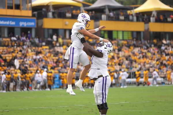Furman's QB Tyler Huff celebrates after scoring a tochdown