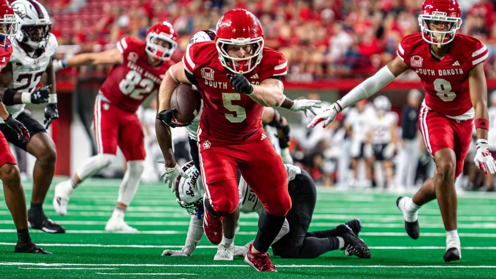 South Dakota RB No. 5 Travis Theis runs the ball against Southern Illinois in a 42-13 victory