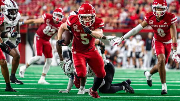 South Dakota RB No. 5 Travis Theis runs the ball against Southern Illinois in a 42-13 victory