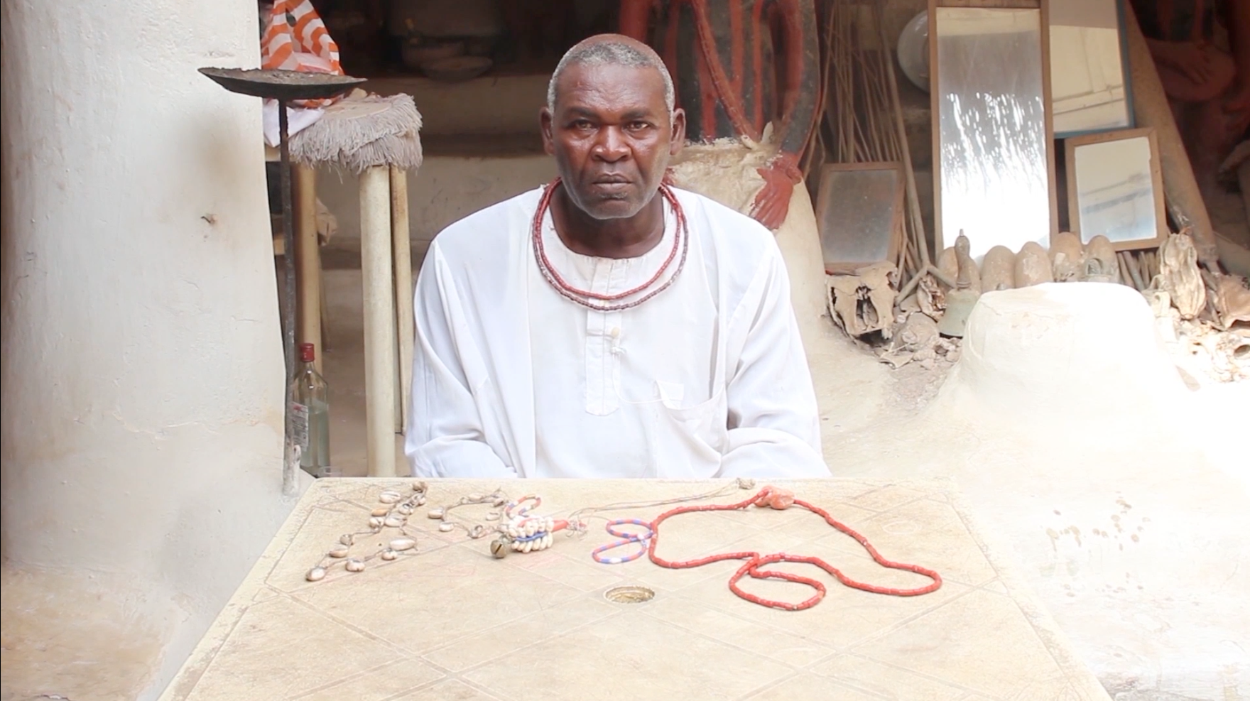Olokun priest showing different types of beads